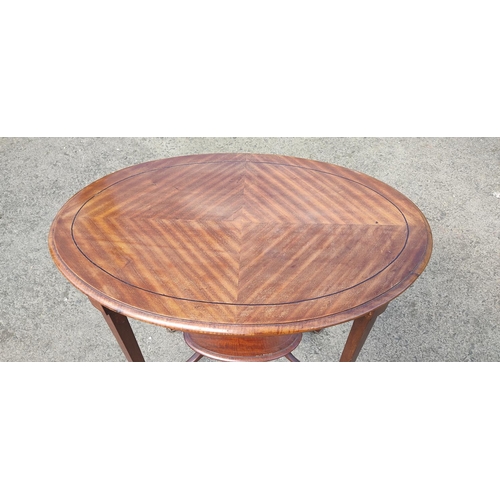 411 - A stunning antique inlaid oval occasional table with undershelf, 70cm x 75cm x 47cm.