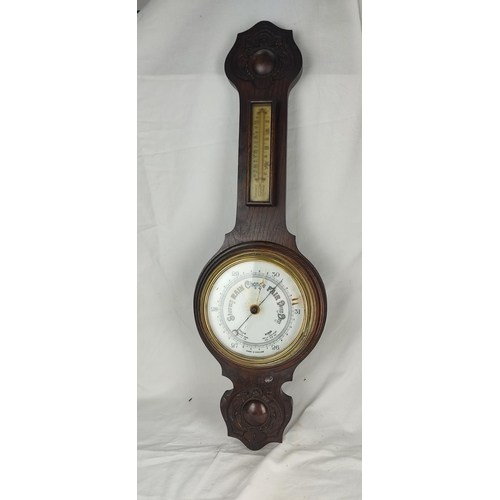 431 - An antique oak cased barometer (a/f).