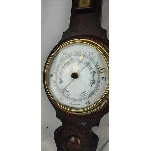 431 - An antique oak cased barometer (a/f).