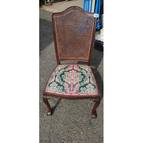 432 - An antique Berger backed chair, carved detail, ball and claw feet.