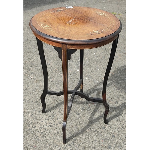 434 - A stunning antique walnut circular topped table with inlay detail on a tripod base.