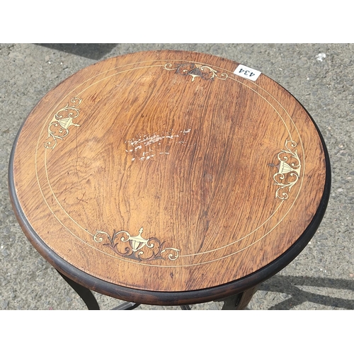 434 - A stunning antique walnut circular topped table with inlay detail on a tripod base.