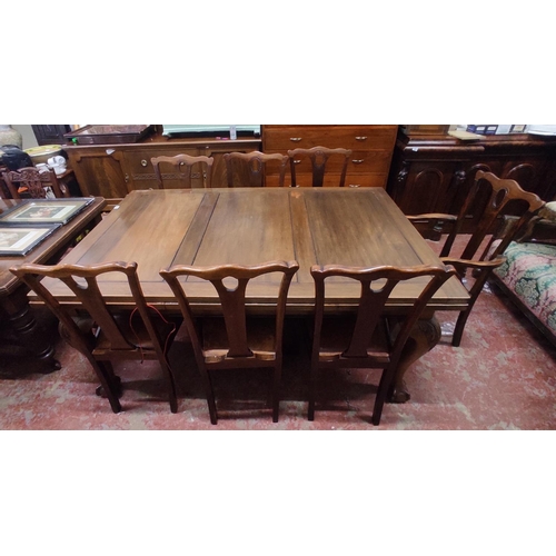 446 - An antique mahogany extending dining room table on ball and claw feet and a set of seven dining room... 