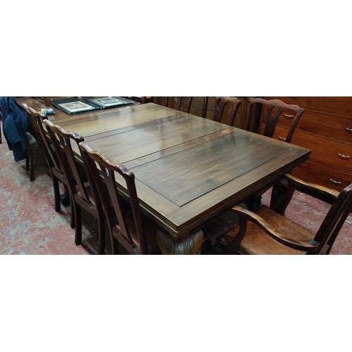 446 - An antique mahogany extending dining room table on ball and claw feet and a set of seven dining room... 