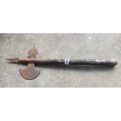 449 - An antique halberd axe, measuring 72cm long.