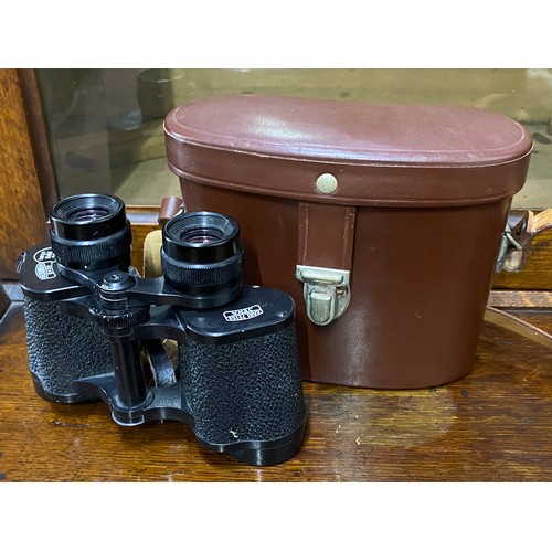 326 - A vintage pair of Jena 8 x 30 field glasses and leather case.