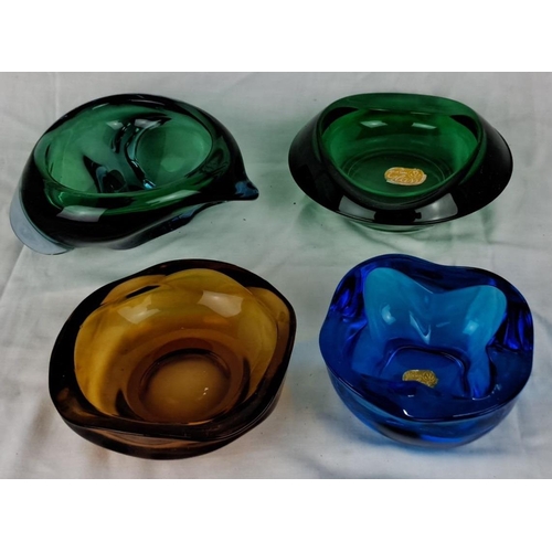 101 - Set of four Bohemian hand-blown art glass bowls in vibrant colours: green, blue, amber, and teal.