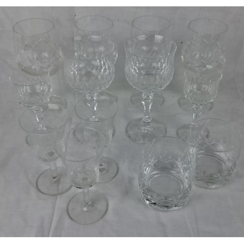 104 - Set of 12 assorted cut crystal glasses, including wine glasses, water goblets, and tumblers with int... 