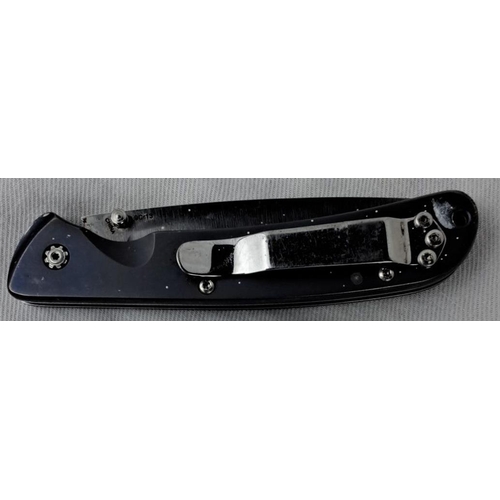 11 - Folding knife with stainless steel blade, featuring 