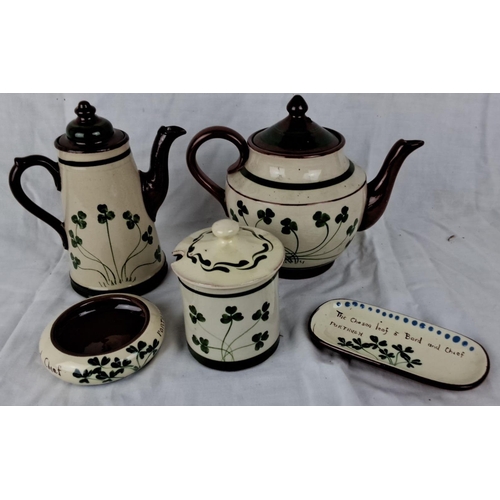 119 - Handcrafted pottery tea set featuring four-leaf clover design. Includes teapot, coffee pot, sugar bo... 