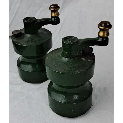 128 - Pair of vintage green cast iron salt and pepper mill grinders with brass knobs.