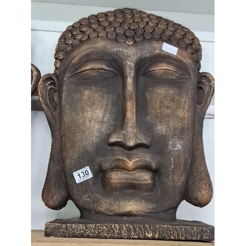 130 - carved Buddha head sculpture featuring intricate details and a serene expression. Measuring 22