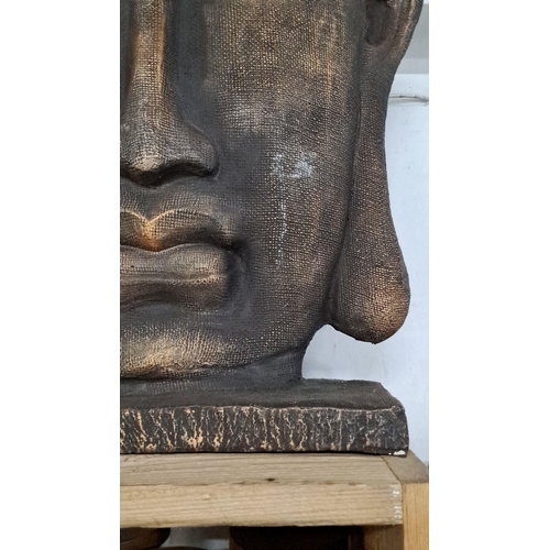 130 - carved Buddha head sculpture featuring intricate details and a serene expression. Measuring 22