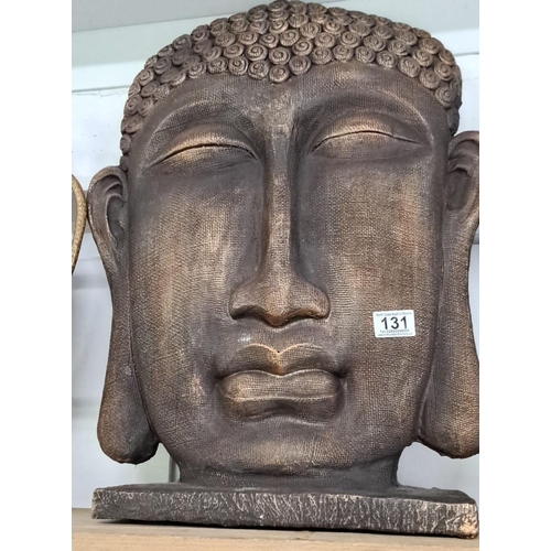 131 - carved Buddha head sculpture featuring intricate details and a serene expression.  Measuring 22