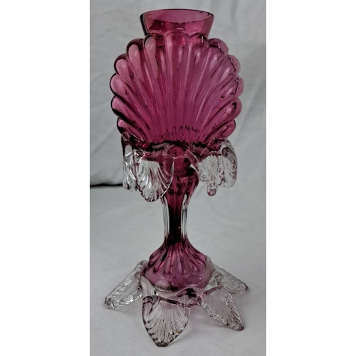 138 - Vintage cranberry glass vase with clear decorative accents. It has a shell motif and an intricate le... 