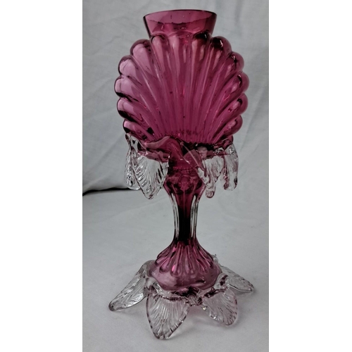 138 - Vintage cranberry glass vase with clear decorative accents. It has a shell motif and an intricate le... 