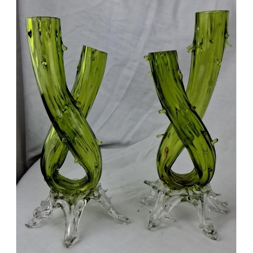 139 - Pair of green art glass vases with twisted design and clear bases. Mid-century modern style, likely ... 