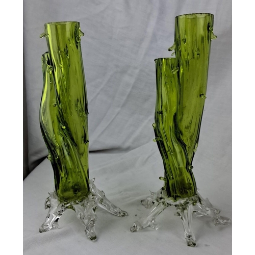 139 - Pair of green art glass vases with twisted design and clear bases. Mid-century modern style, likely ... 