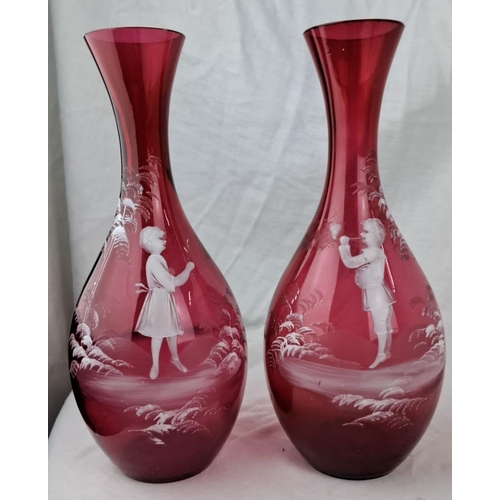 140 - Pair of Mary Gregory cranberry glass vases, featuring hand-painted white enamel children and floral ... 