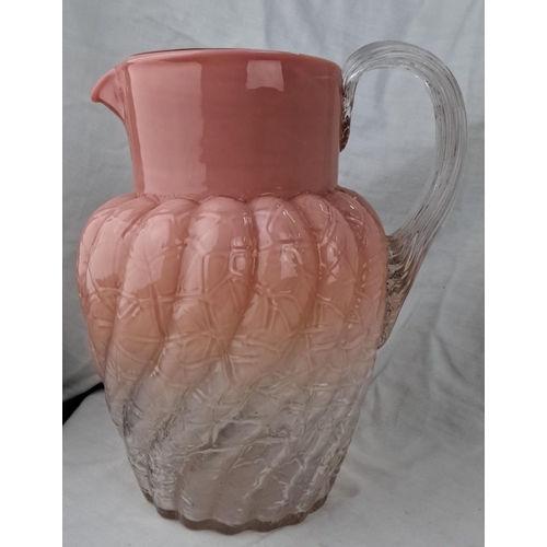 141 - Vintage pink and clear glass pitcher with a ribbed texture, clear glass handle and a gradated pink t... 