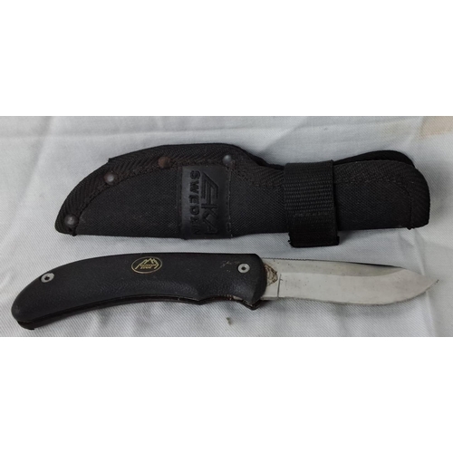 15 - EKA Sweden folding blade knife with black handle and sheath. Blade inscribed 