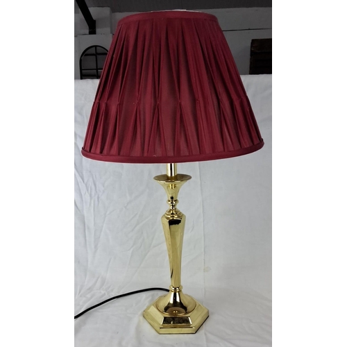 25 - Brass table lamp with a hexagonal base and a burgundy pleated shade.