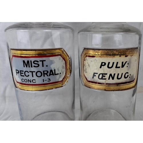 29 - Pair of vintage clear glass apothecary jars with original labels: “MIST. PECTORAL.” and “PULV: FŒNUG... 