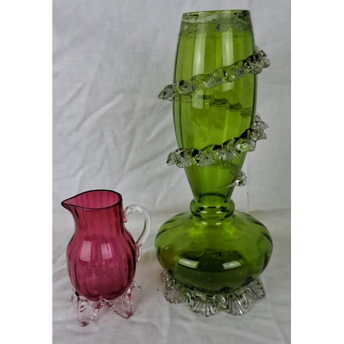 34 - Pair of hand-blown glass items: one green vase with clear ruffled accents, and one pink jug with cle... 