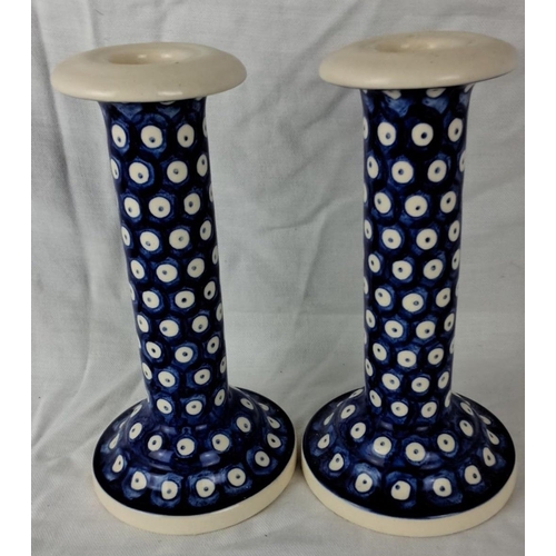 42 - Pair of Polish ceramic candlesticks featuring a navy blue and white polka dot design. Marked 