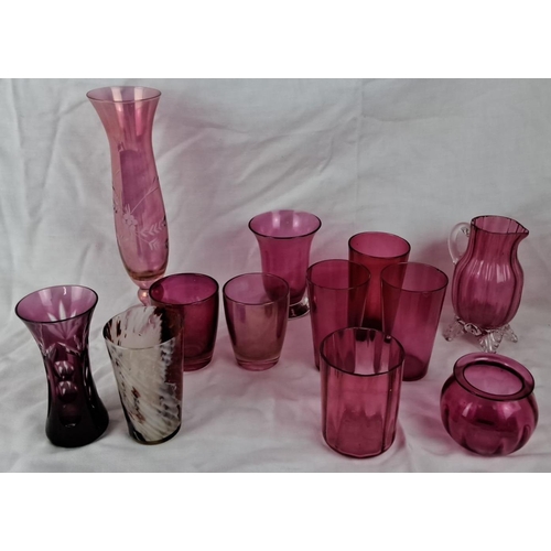 48 - Collection of 11 assorted ruby glass vases and pitchers. They come in varied shapes and sizes and in... 