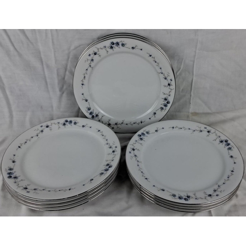 51 - Set of 9 Royal porcelain plates from West Germany, featuring a delicate blue floral pattern and silv... 