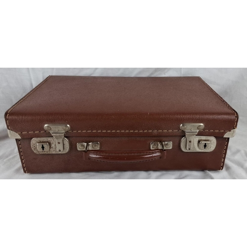 56 - Vintage Noton Luggage suitcase with brown leather exterior and patterned interior lining. Made in En... 