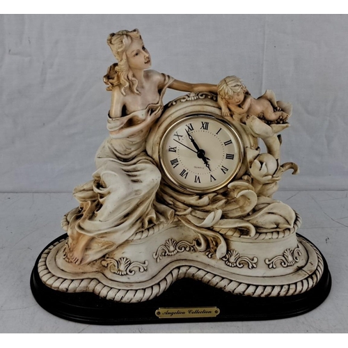 576 - Porcelain clock from the Angelica Collection featuring classical figures, ornate detailing, and Roma... 