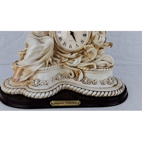 576 - Porcelain clock from the Angelica Collection featuring classical figures, ornate detailing, and Roma... 