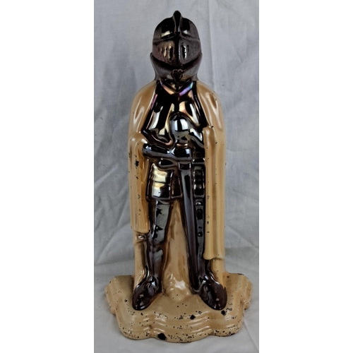 58 - Cast iron knight-shaped doorstop, painted in metallic shades. The back side reveals hollow construct... 