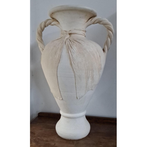 583 - Large white ceramic amphora-style vase with twisted handles and draped fabric detail. Height: 29 inc... 