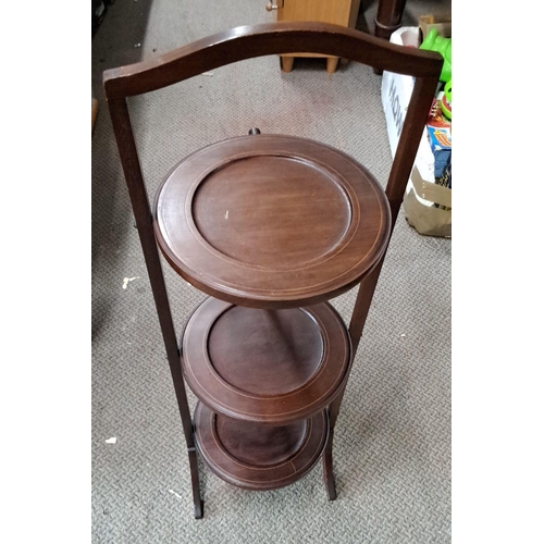 586 - Three-tier wooden folding cake stand, crafted from dark-stained mahogany. Timeless design with class... 