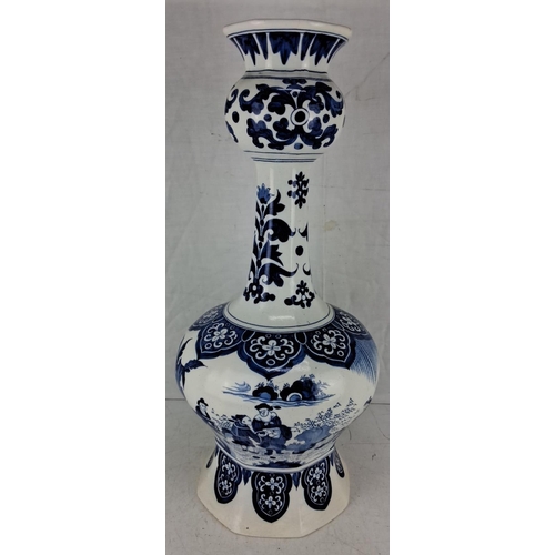 593 - Blue and white porcelain vase with intricate floral and landscape design, marked on the bottom, poss... 