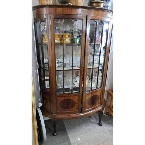 594 - Edwardian mahogany display cabinet, curved glass panels with carved detailing, circa early 1900s.