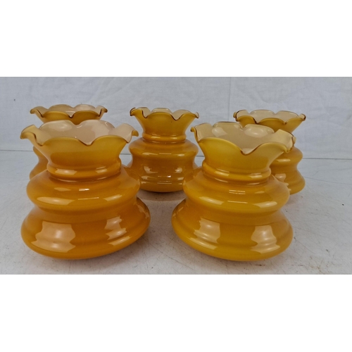 596 - Set of five vintage amber glass shades with ruffled edges. They showcase a golden yellow hue transit... 