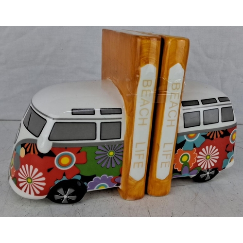 603 - Ceramic bookends with a colorful, floral-themed VW van design and the words 