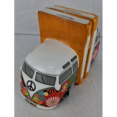 603 - Ceramic bookends with a colorful, floral-themed VW van design and the words 