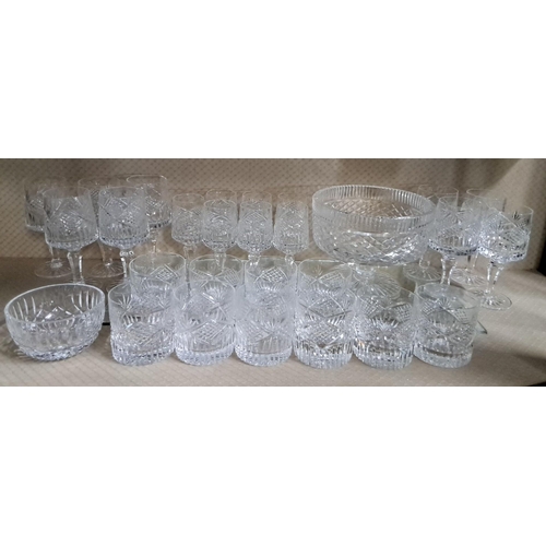 606 - Crystal glassware set, including 24 assorted glasses, 2 serving bowls, and a large punch bowl, featu... 