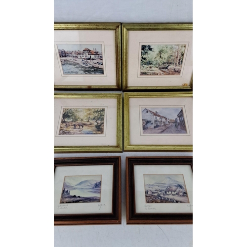 609 - Framed watercolor landscape and townscape paintings, featuring scenes of towns, forests, rivers, and... 