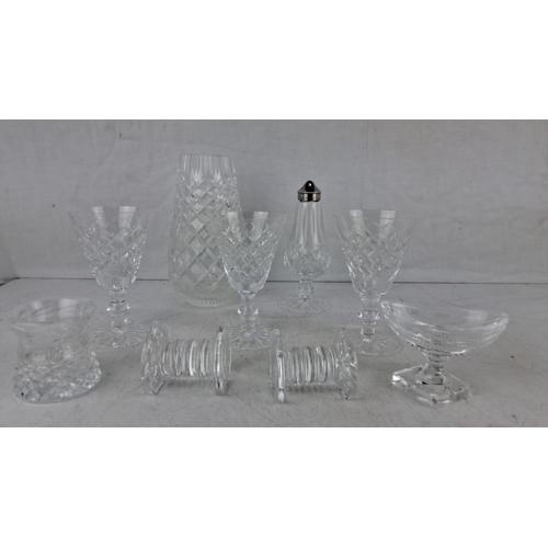 611 - Collection of nine cut glass crystal items. Includes goblets, a vase, a salt shaker with a silver to... 