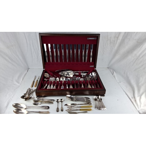 619 - Silver-plated flatware set in wooden case, including knives, forks, spoons, and serving utensils.