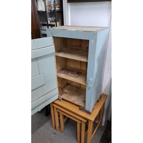 620 - A vernacular wooden storage cabinet with a pale blue distressed finish, featuring a hinged door and ... 