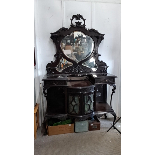 633 - Antique Victorian mahogany dresser with intricately carved details, featuring a heart-shaped mirror ... 