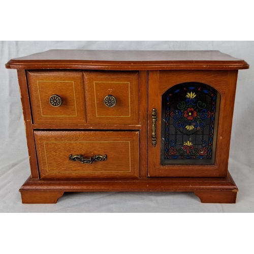 81 - Vintage wooden jewellery box with glass door, inclusive of assorted costume jewellery such as neckla... 