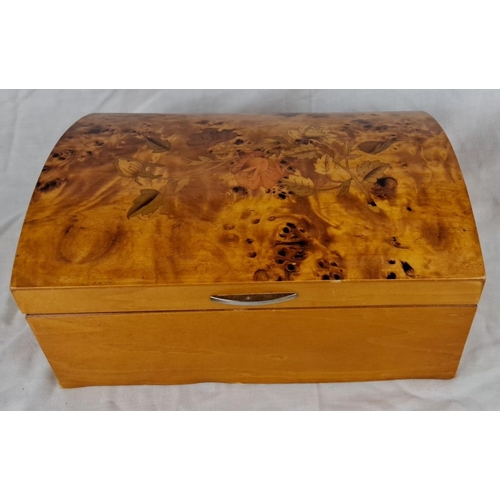 87 - A wooden jewellery box with floral inlay design. Includes assorted jewellery pieces organized within... 